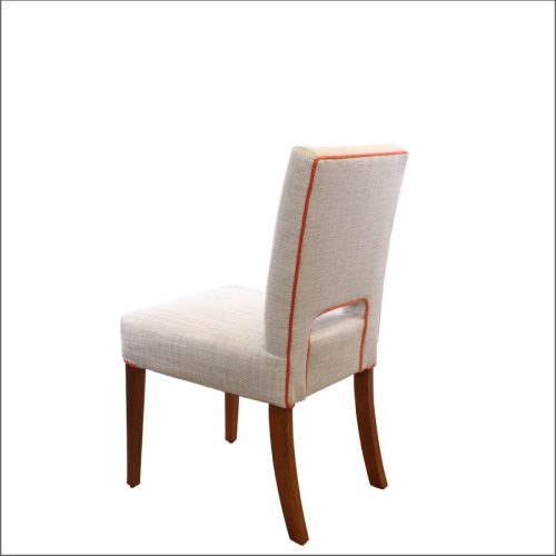 Cream chair with orange piping