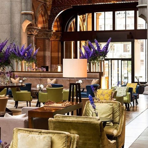 Hotel lobby with reupholstered green chairs