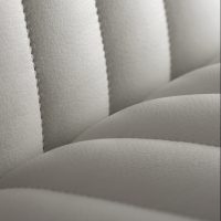 Close up of fluted stitching on white chair