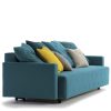 Blue sofa bed with different coloured cushions